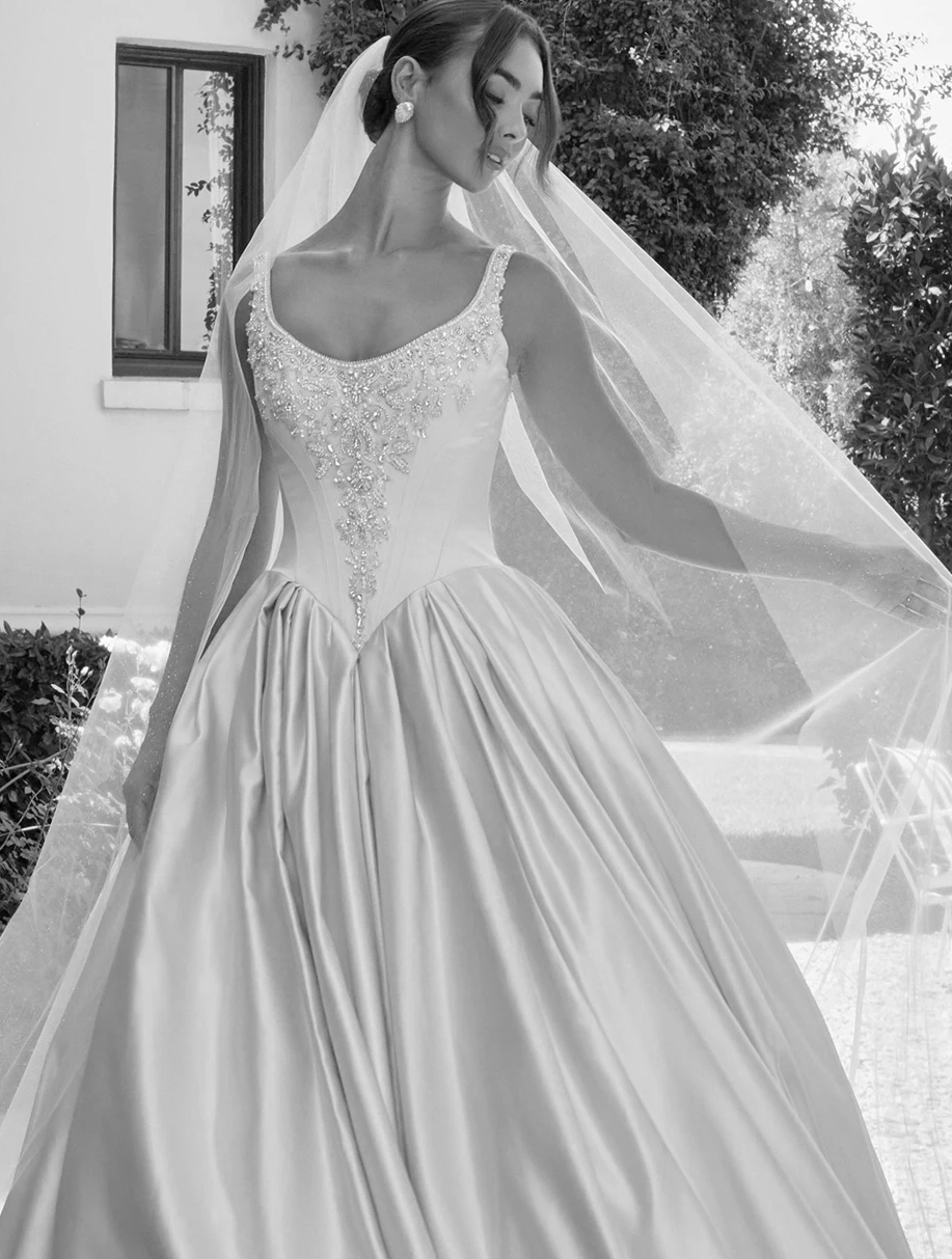 Сouple wearing a white gown and a black suit