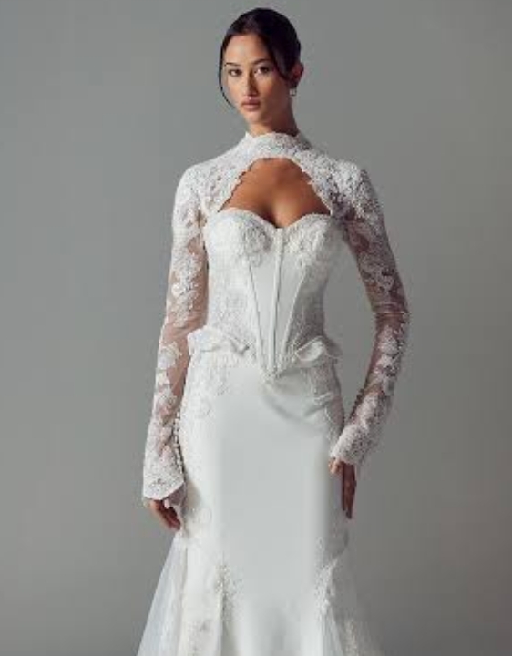 Model wearing a gown by Evie Young