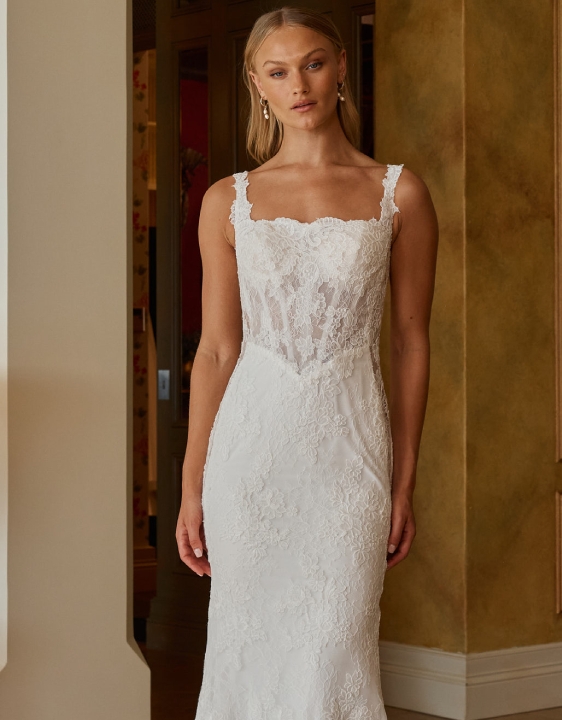 Model wearing a gown by Madi Lane