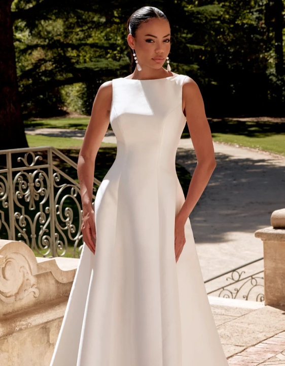 Model wearing a gown by Justin Alexander Sincerity