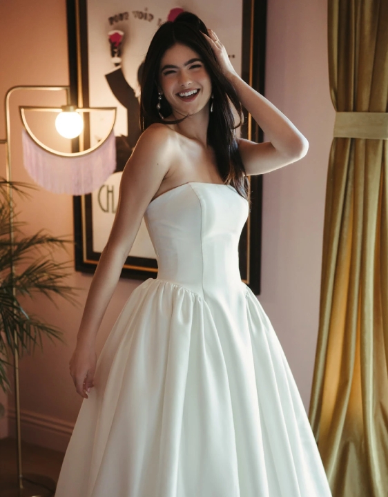 Model wearing a gown by Stella York