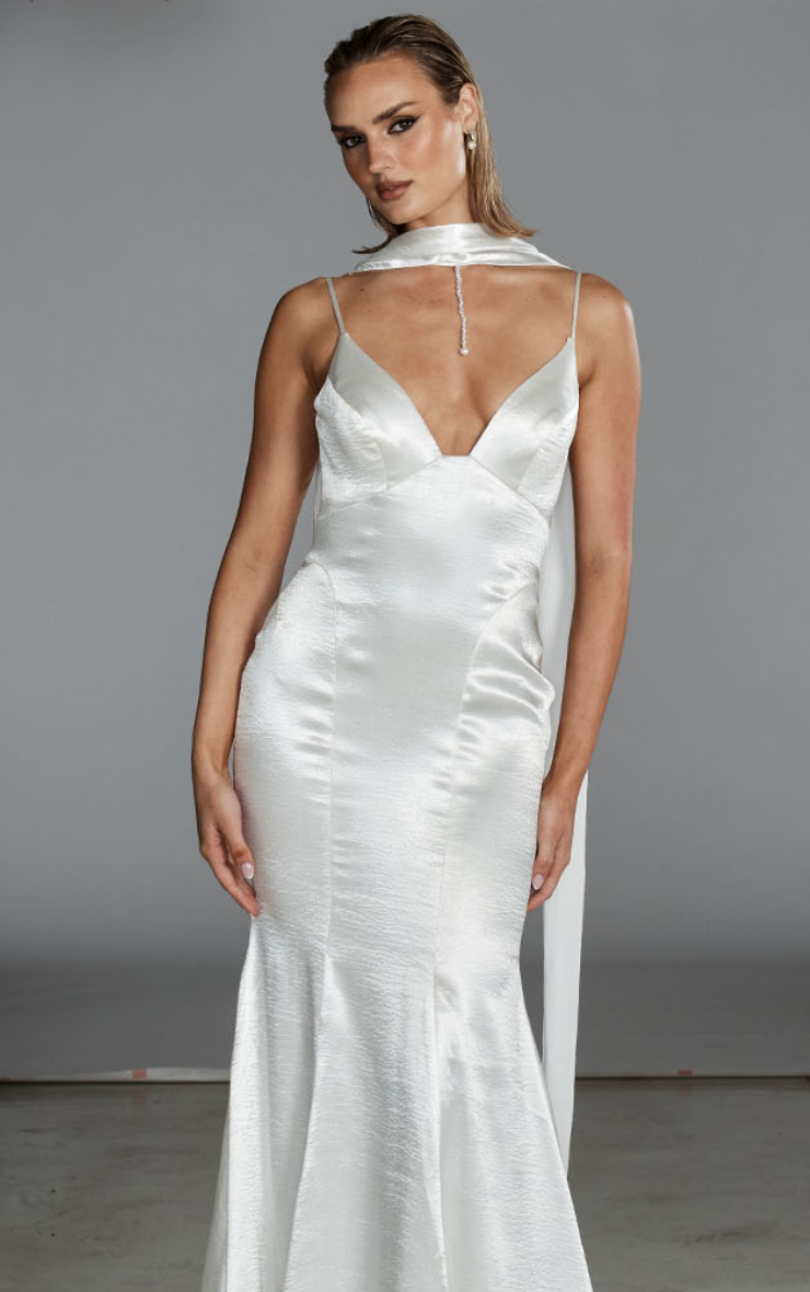 Model wearing a gown by Evie Young