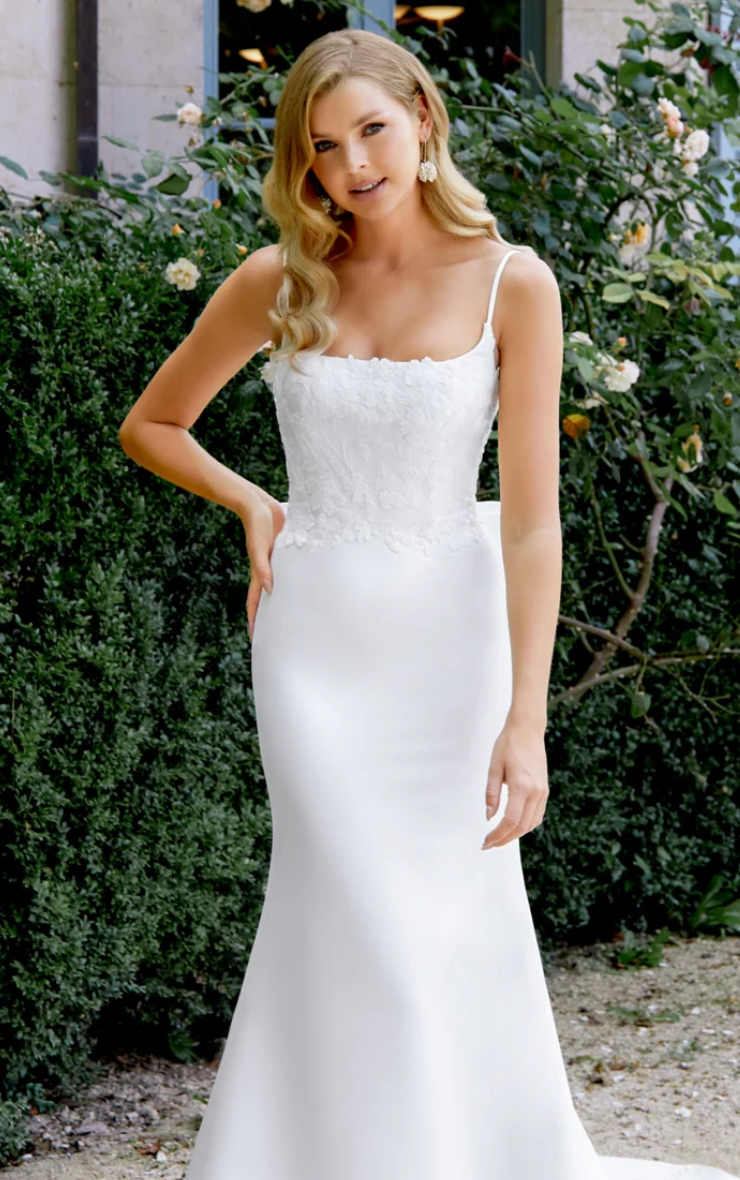 Model wearing a gown by Justin Alexander Sincerity