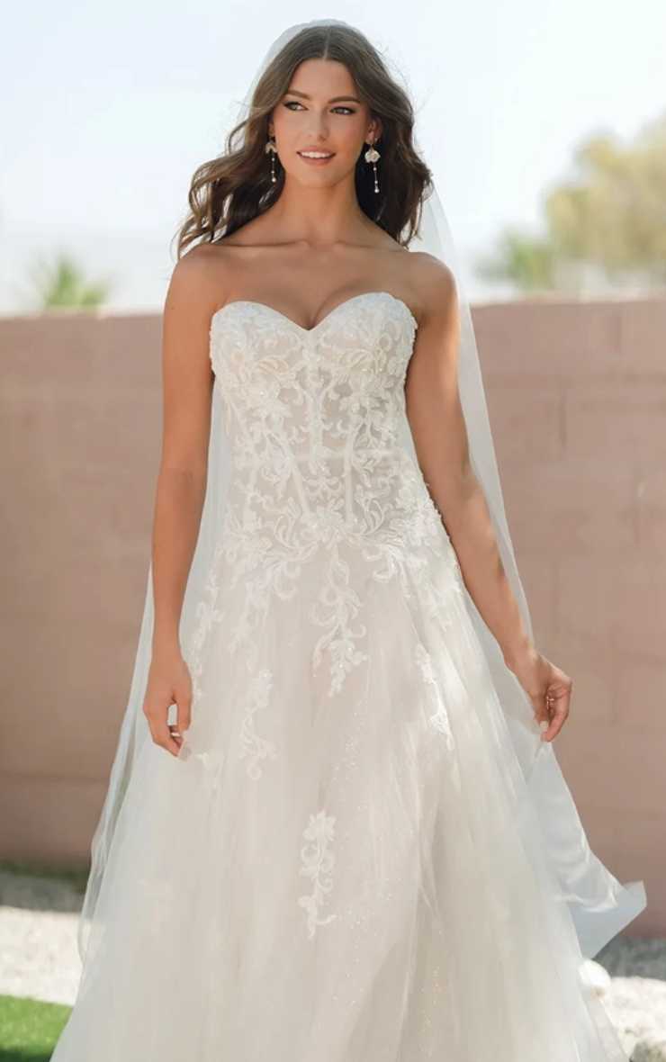 Model wearing a gown by Stella York